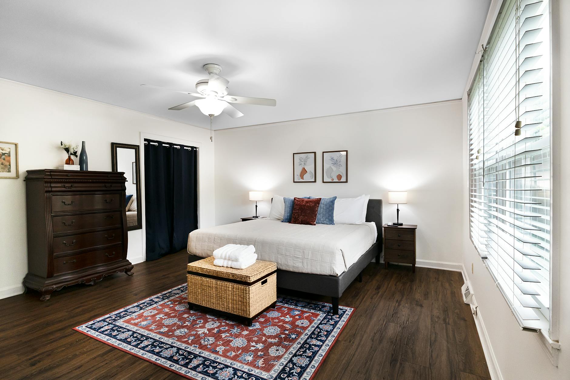 King size bed in an elegant bedroom with stylish wood accents