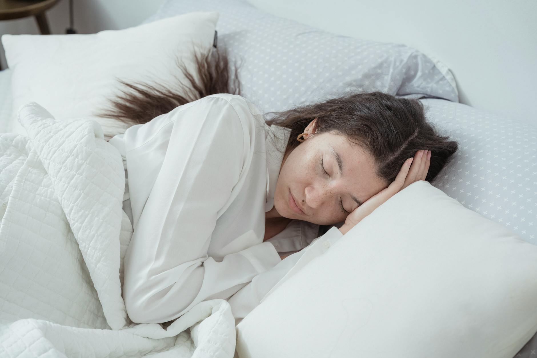Woman sleeping peacefully on a comfortable mattress