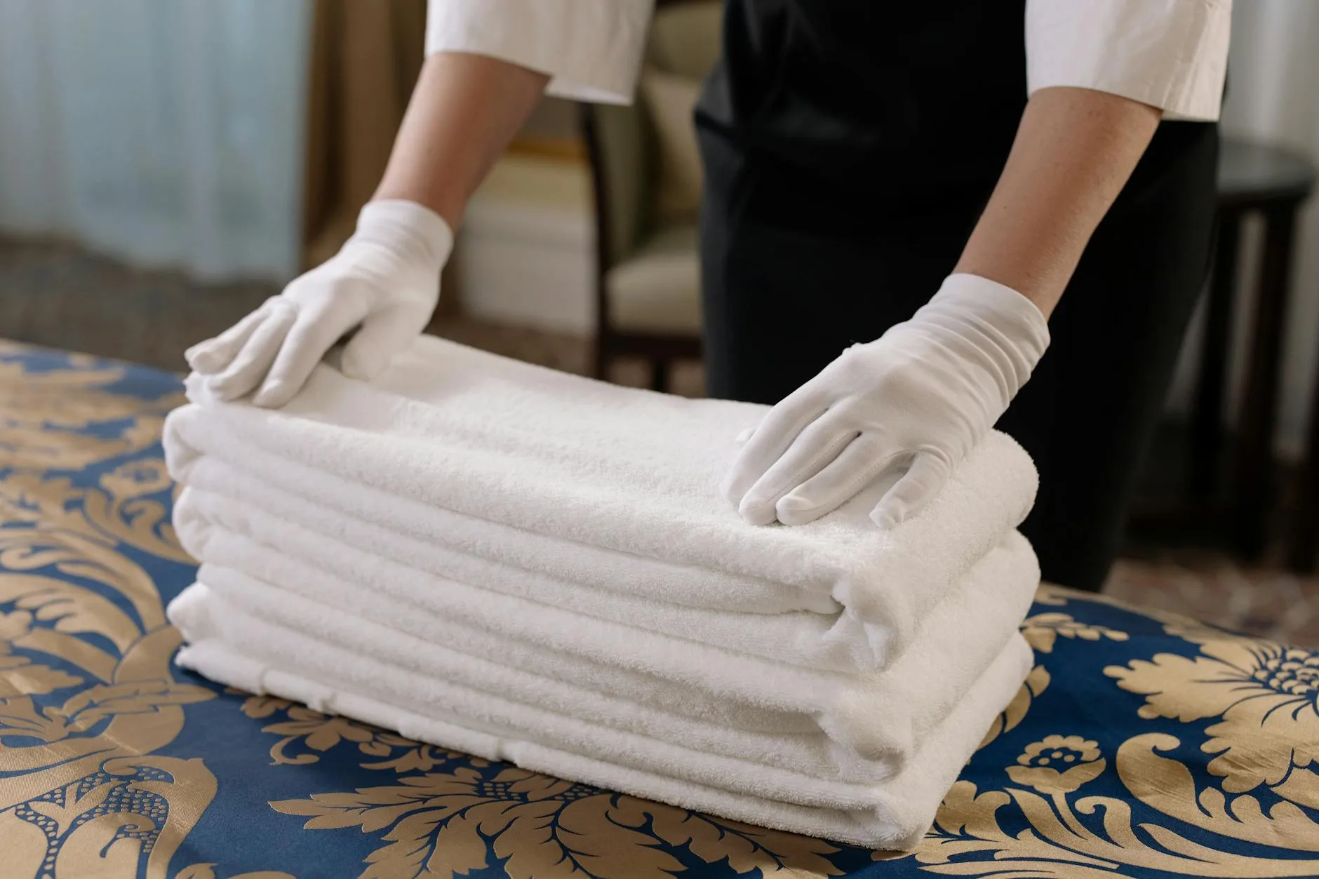 Stack of freshly washed and folded white bedding