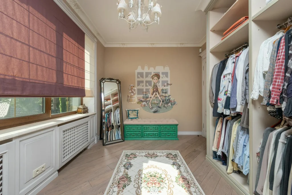 Organised bedroom dressing area with wardrobe and full-length mirror
