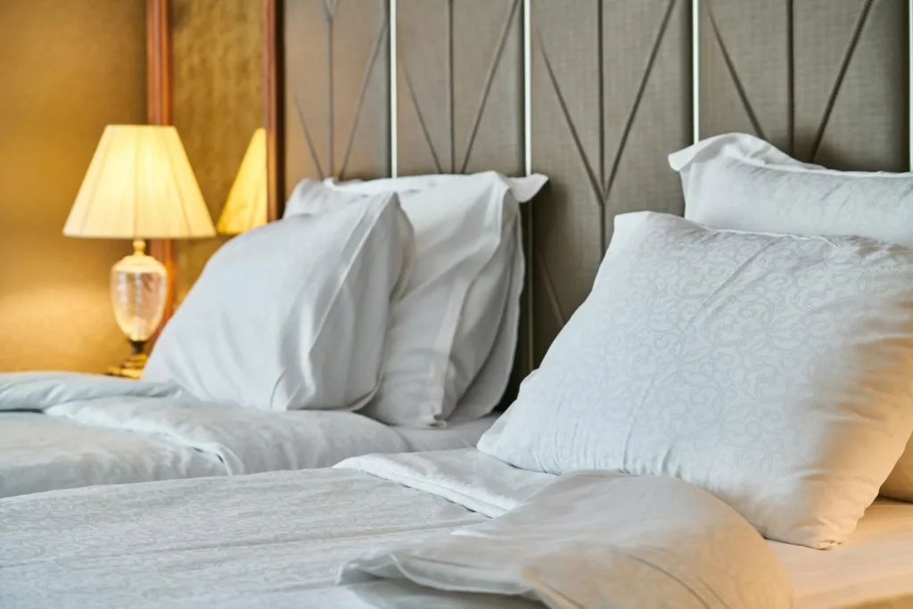 Comfortable mattress on bed frame in modern UK bedroom