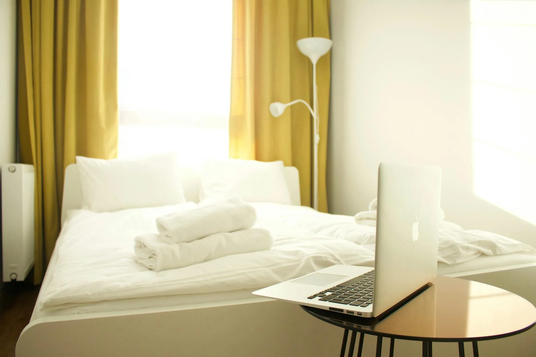 Bright airy bedroom with window light for cool sleeping