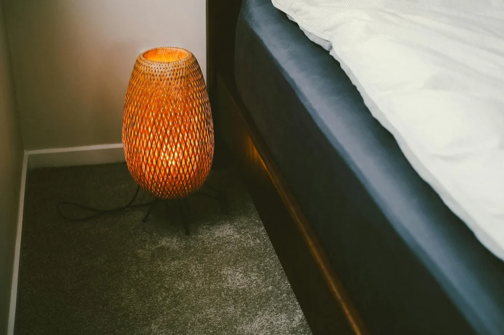 Modern cozy bedroom with warm bedside lighting