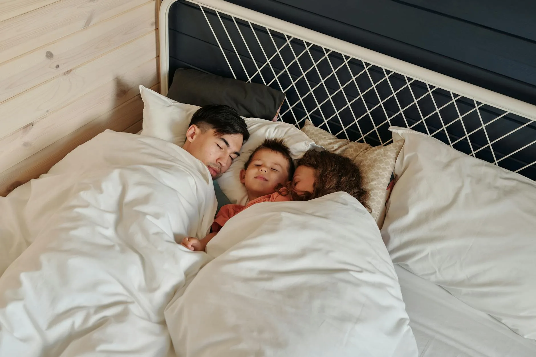 Family sleeping peacefully on a certified safe mattress