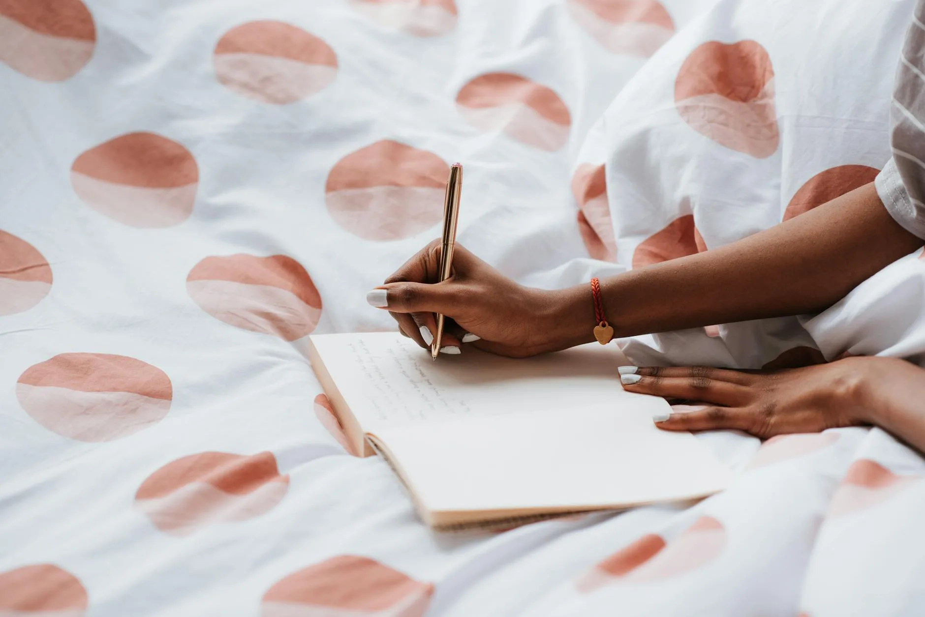 Person writing in a journal as part of a morning routine