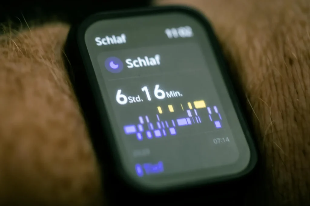 Person checking sleep data on a wearable — sleep tracker comparison