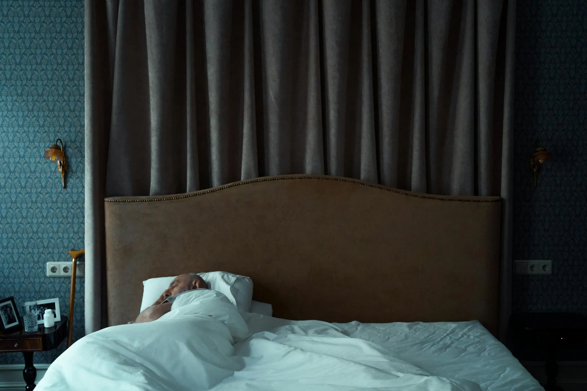 Person sleeping comfortably on a bed with pillows