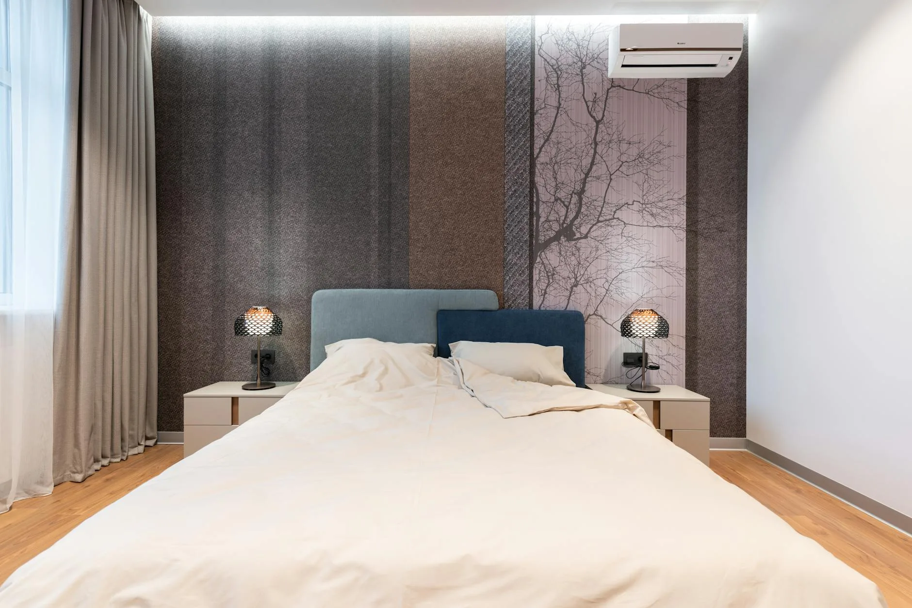 Upholstered fabric headboard against a bedroom wall