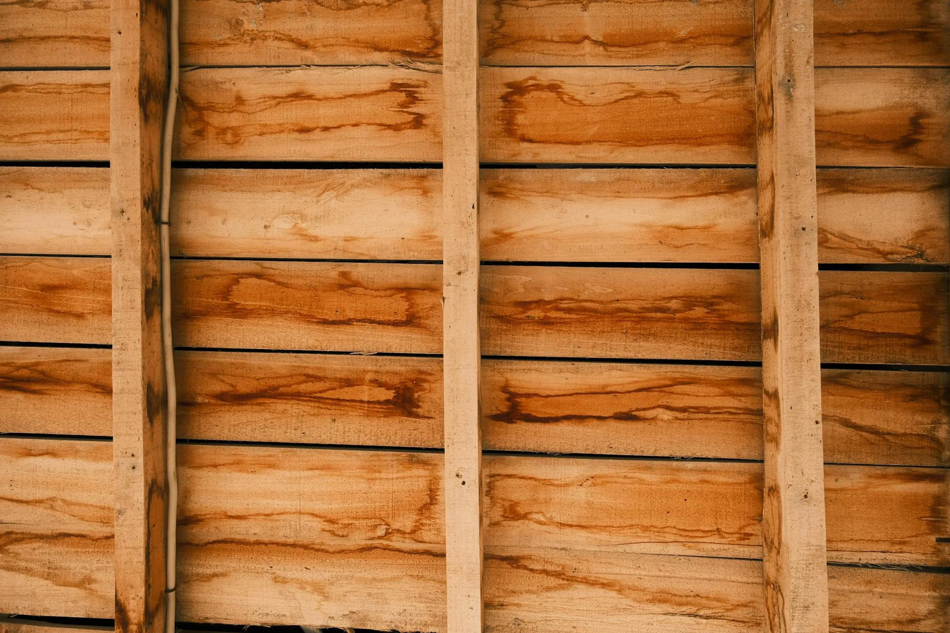 Close-up view of wooden slat bed frame construction showing support structure