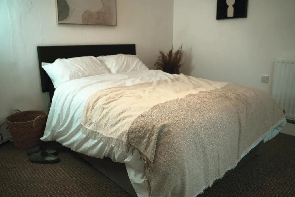 Cosy bedroom with warm blankets and bedding