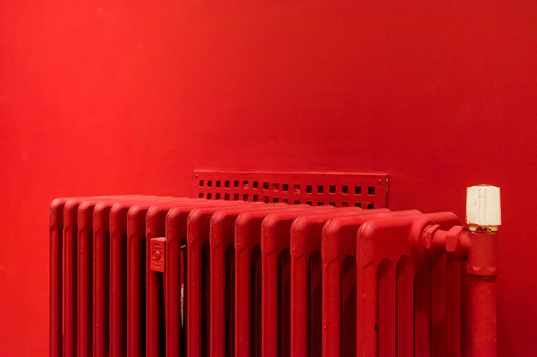 Home thermostat on a radiator showing heating temperature