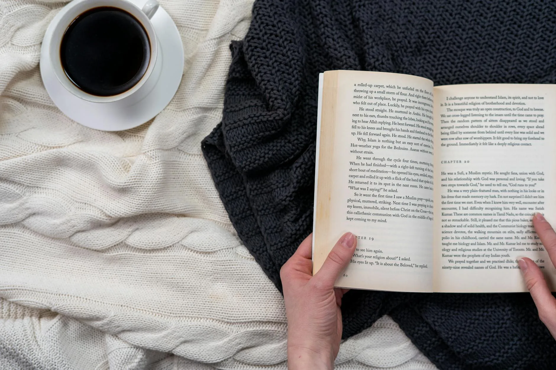Person wrapped in a cosy blanket on the sofa