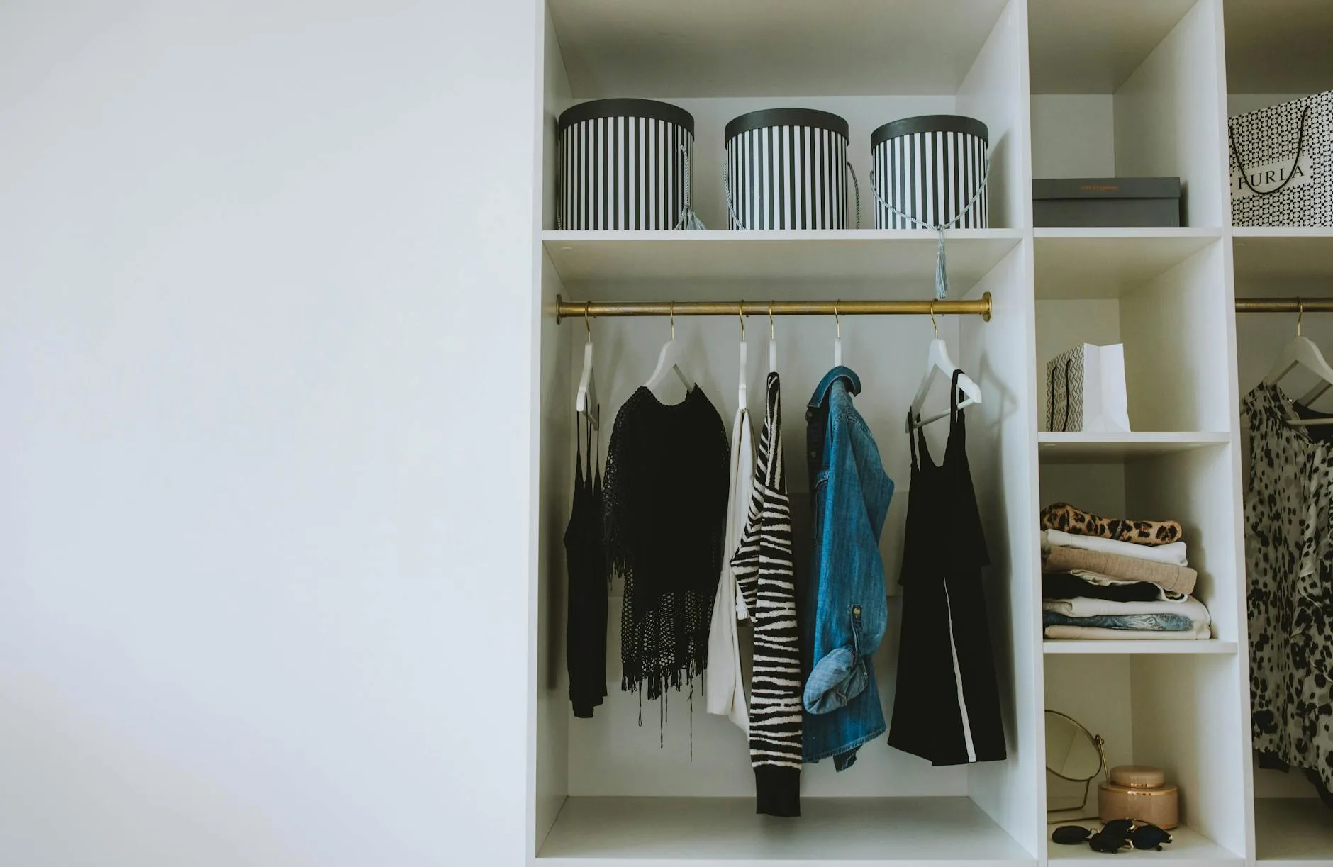 Well-organised wardrobe interior with shelves and clothes