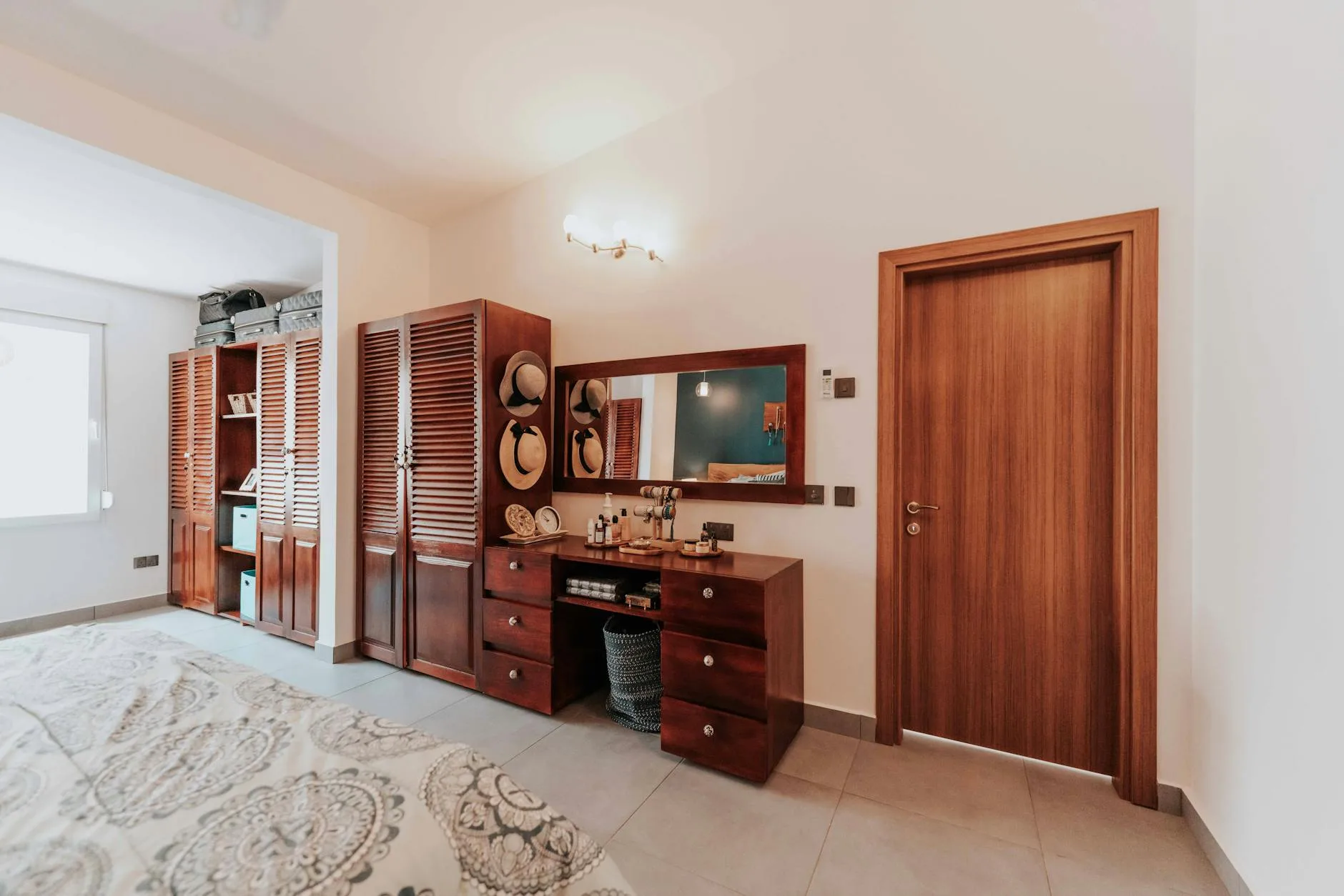 Sliding door wardrobe with mirror in a bedroom
