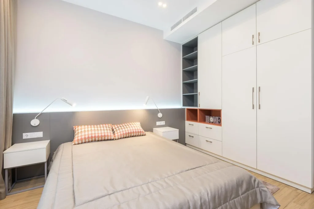 White modern wardrobe in a small bedroom