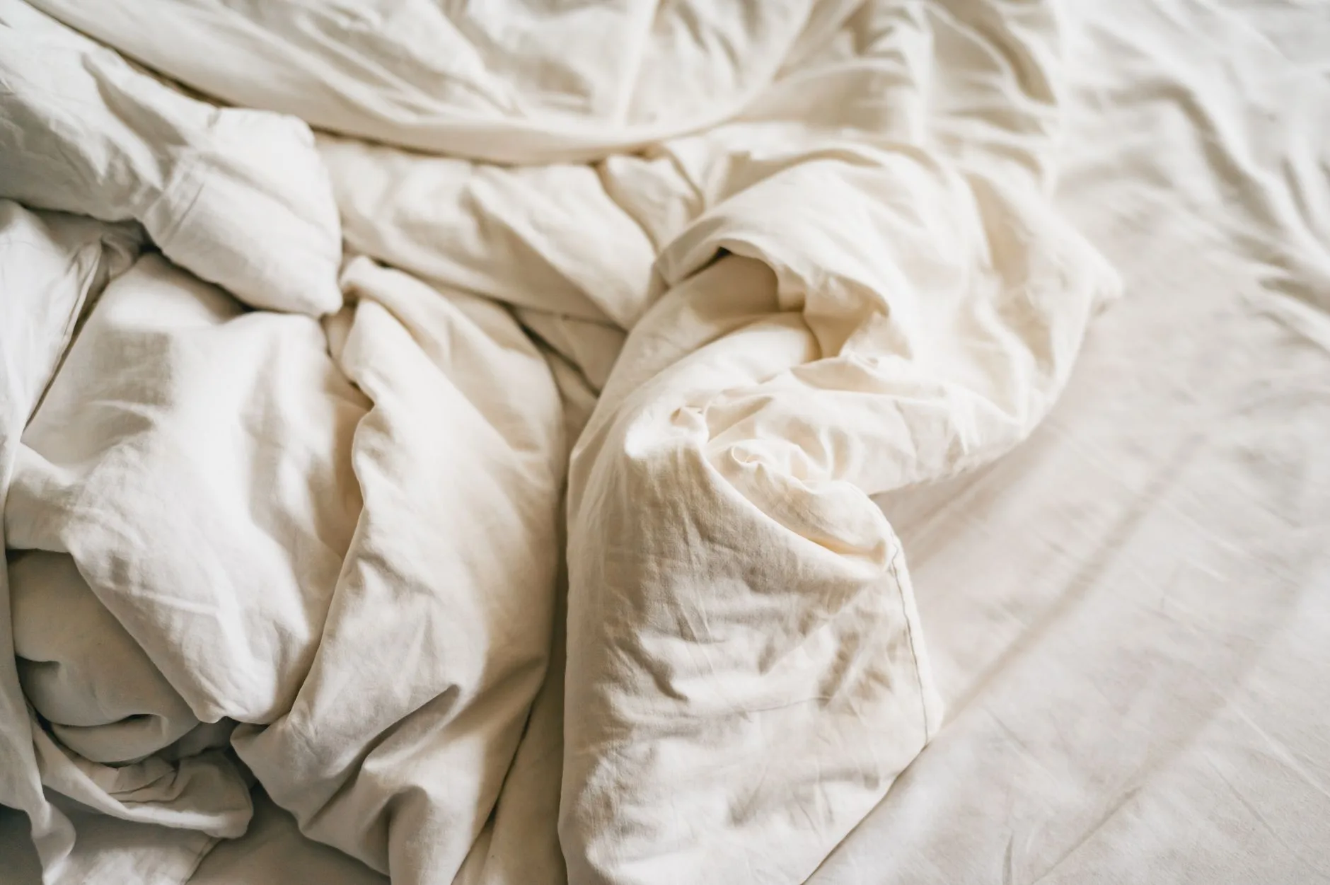 Close-up texture of linen bedding on a bed