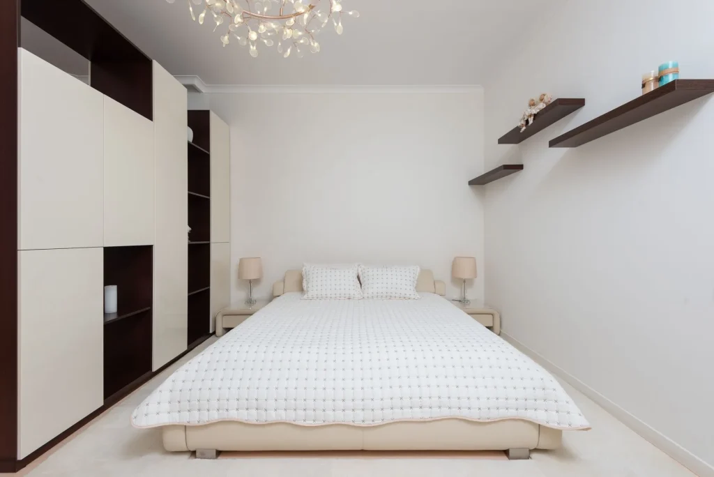 Affordable mattress on a simple bed in a neutral bedroom