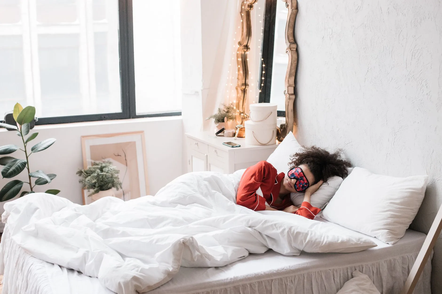 Bluetooth sleep mask headphones placed on a bed