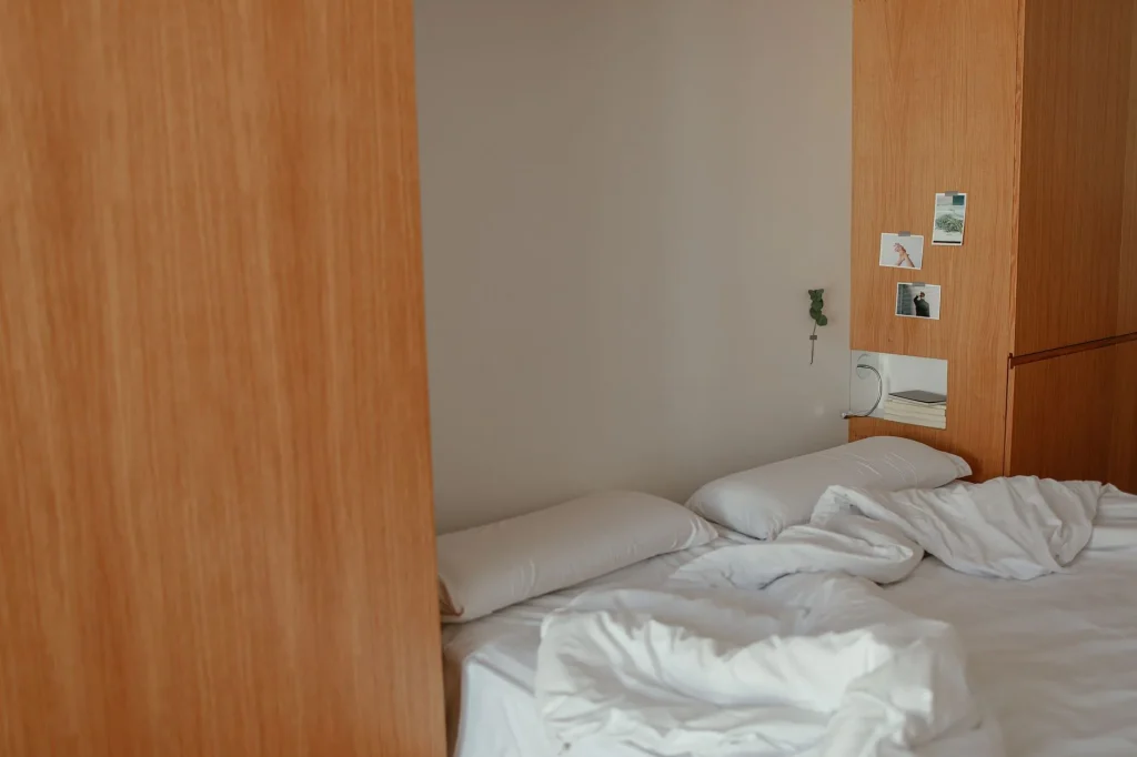 Warm winter bedding on an empty cosy bedroom bed