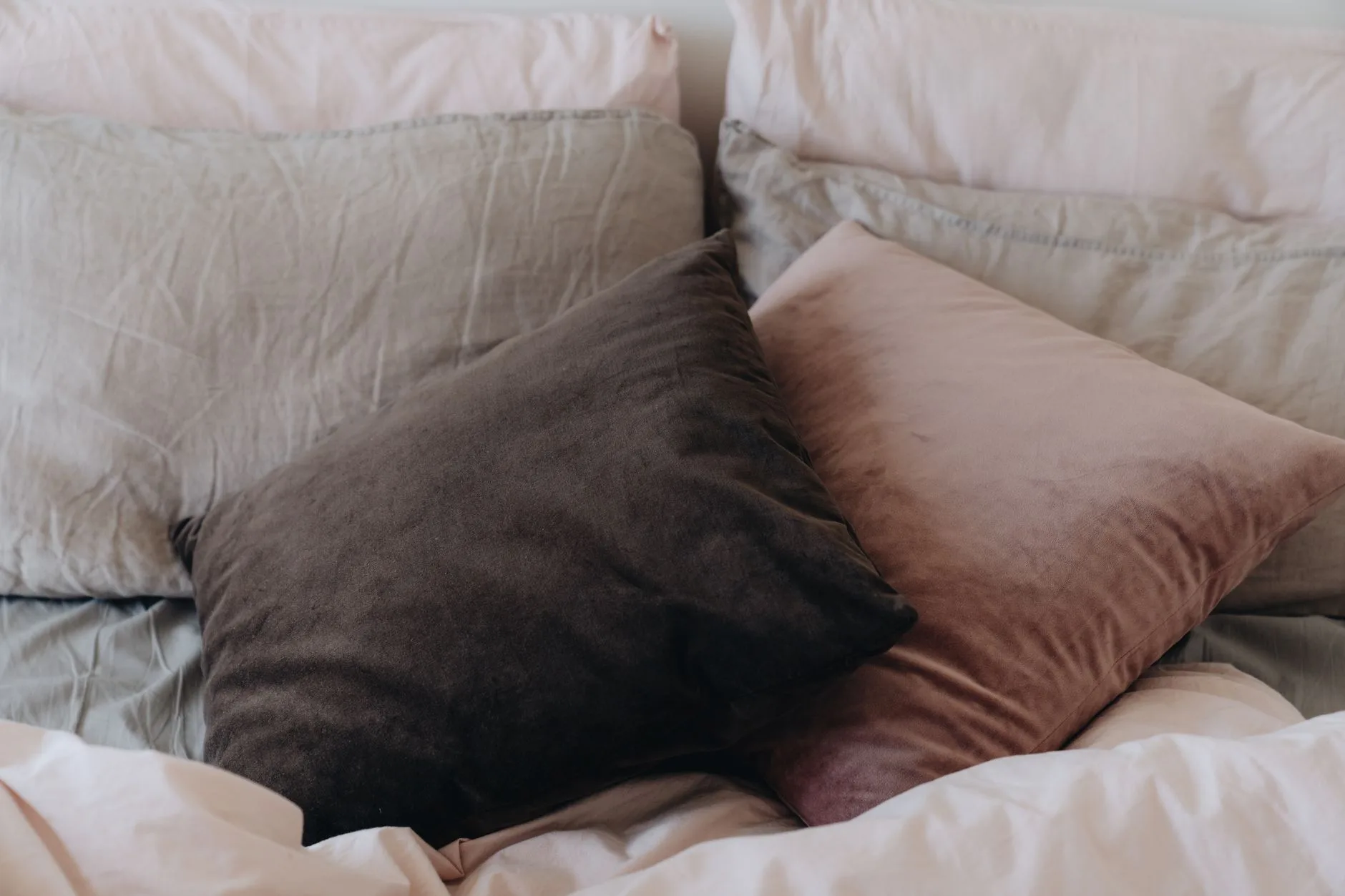 Old pillow on a bed for checking pillow support and shape
