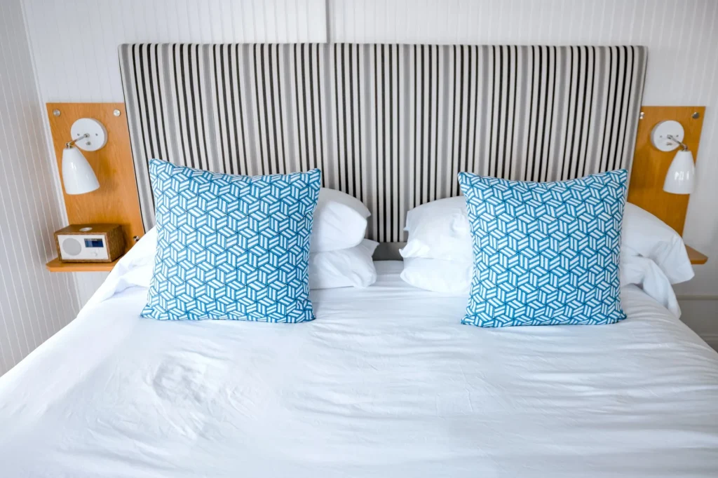 How often replace pillows guide with clean white pillows on a bed